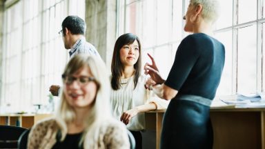 Businesswomen in discussion in design office